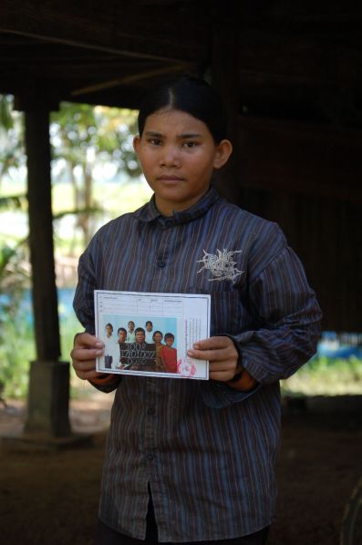Miss Siep Sokhom with the certificate saying that her family is one of the poorest